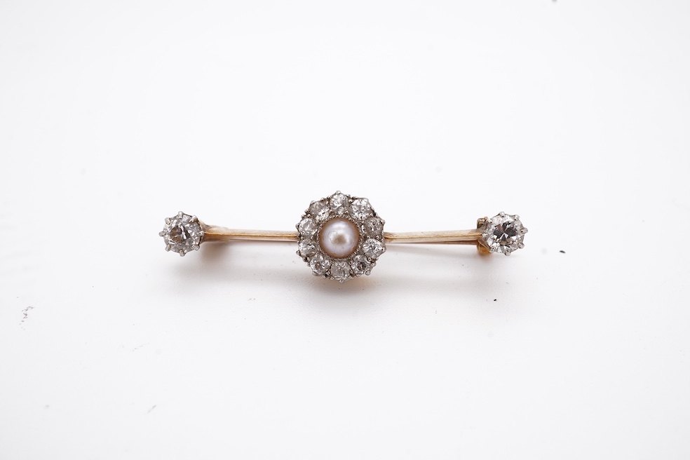 An early to mid 20th century yellow metal, split pearl and diamond cluster set bar brooch, 37mm, gross weight 4.3 grams. Condition - fair